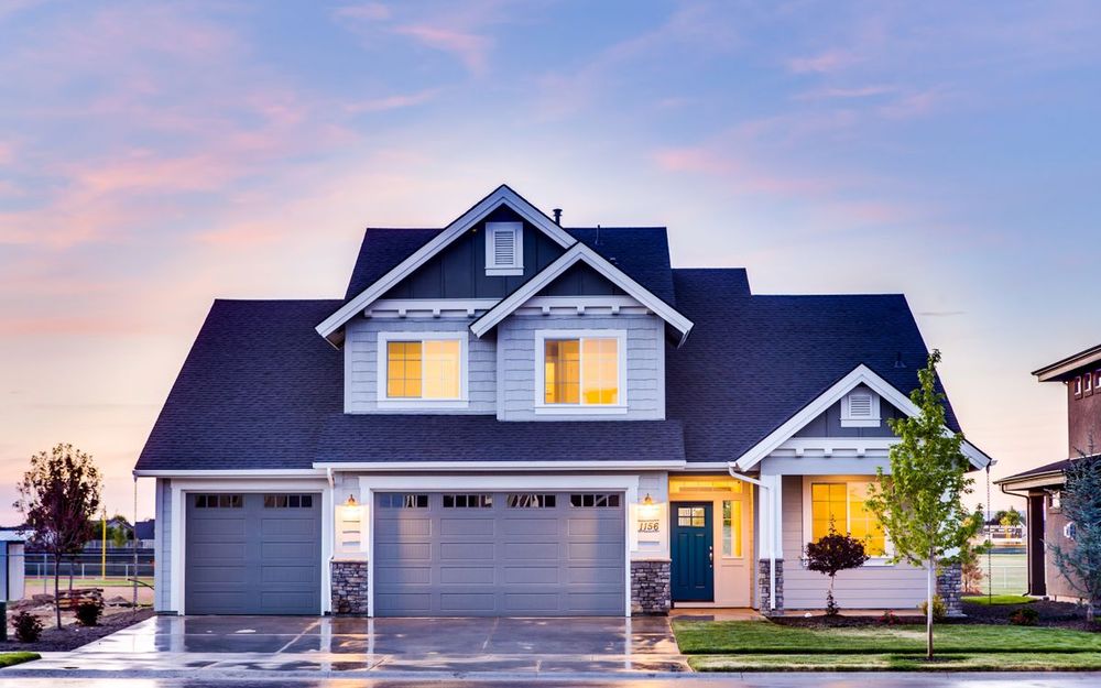 Family home at dusk representing a first mortgage purchase